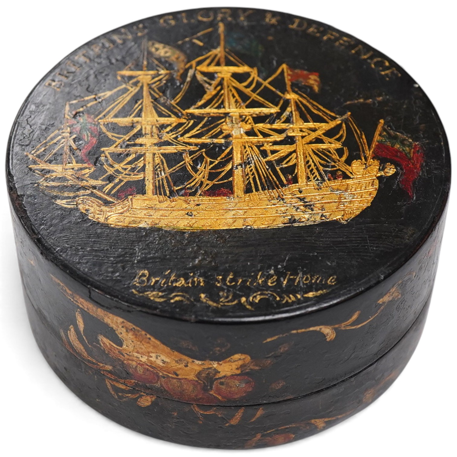 A 19th century 'Britains Glory & Defence' gilt decorated black lacquer circular box, 8.5cm diameter